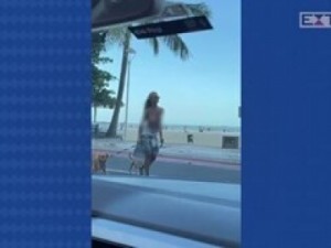 Mulher de topless é detida em Balneário Camboriú (SC) enquanto passeava com cachorros