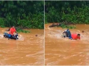 Motociclista é arrastado por correnteza e fica submerso ao tentar atravessar rua alagada