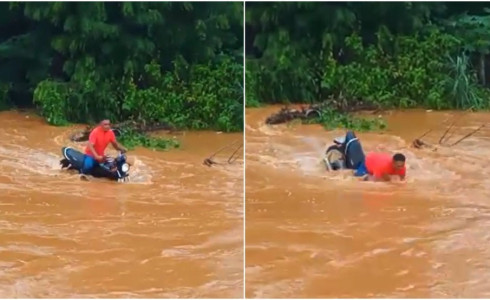 Motociclista é arrastado por correnteza e fica submerso ao tentar atravessar rua alagada